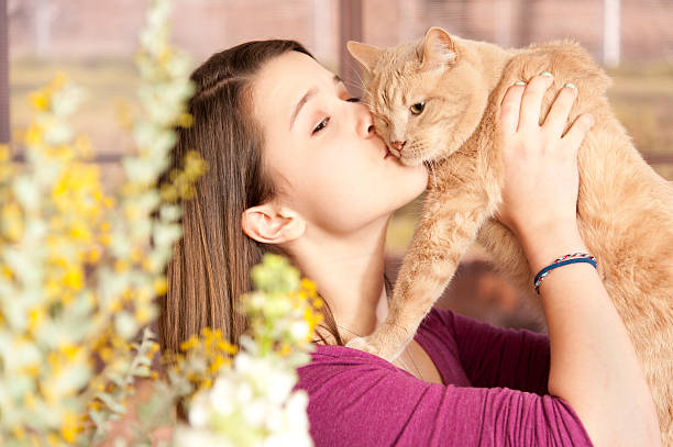 istock Young Girl Kissing Her Cat 139467644