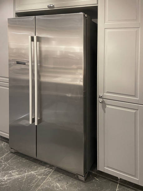 istock Domestic kitchen, stainless steel modern refrigerator in the kitchen 1394677294