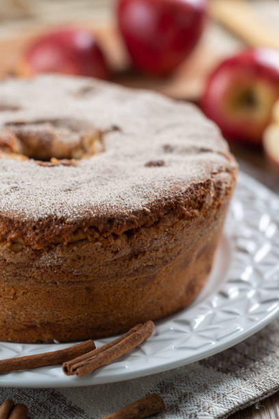 istock Sponge cake or chiffon cake with apples so soft and delicious sliced ingredients: cinnamon, eggs, flour, apples on wooden table. Home bakery concept for background and wallpaper 1394690570