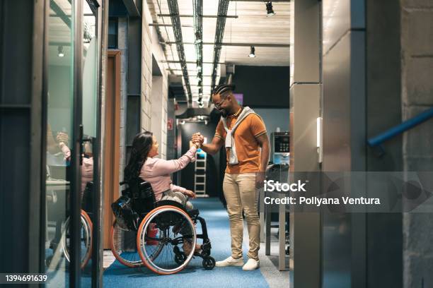 Employees Shaking Hands Stock Photo - Download Image Now - Respect, Persons with Disabilities, Human Rights