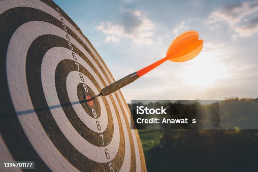 istock business marketing as concept. Red dart arrow hitting in the target center of dartboard Target hit in the center. 1394701177