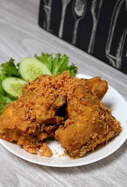 istock Crunchy fried chicken on a white plate. 1394704864