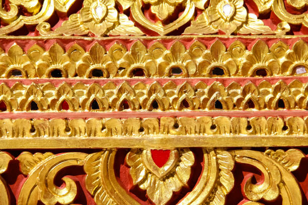 istock Gold red wall floral engraving  patterns for decorative thai style in temple on background 1394706632