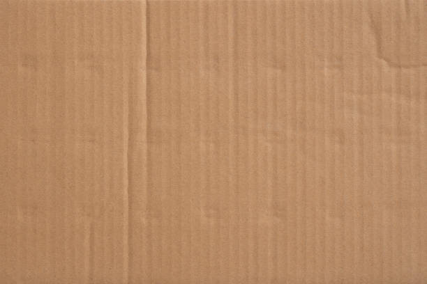 istock Old cardboard background with folds and creases. 1394706692