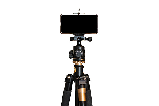 Smartphone on tripod isolate white background. blank black screen. copy space