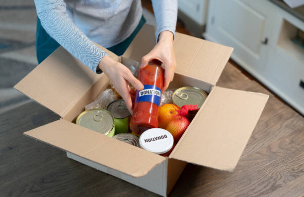 istock Filling a food box for donation 1394711142