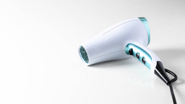 istock Ceramic ionic hairdryer on white background.  Modern device for hairstyling large background for banner.Copy space 1394711215