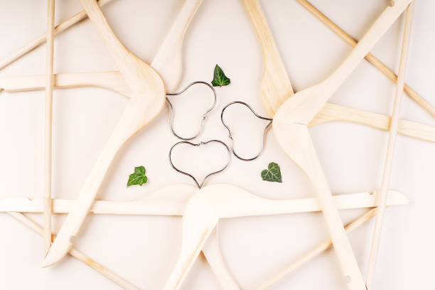 istock Hangers with plants on white background with copy space.Conscious and environmentally friendly consupmtion in shopping.Recycling or zero waste concept.Shopping,sale,promo concept. 1394711328