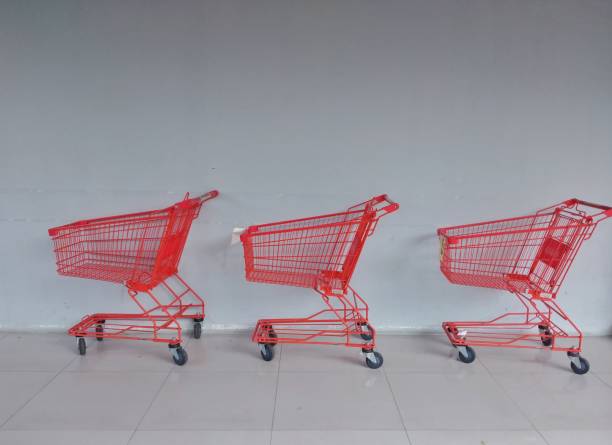 istock Empty metallic supermarket shopping cart side view. 1394712371
