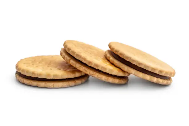 Sandwich cookies with chocolate. Isolated on white.