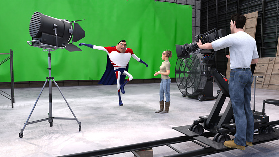 Digital render of a small green screen studio set with a superhero acting