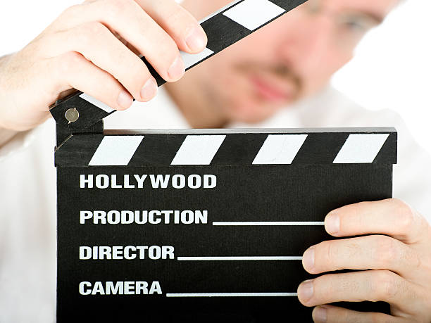 istock businessman with a film slate 139471645