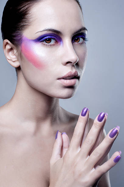 istock woman with colorful makeup on face 139472052