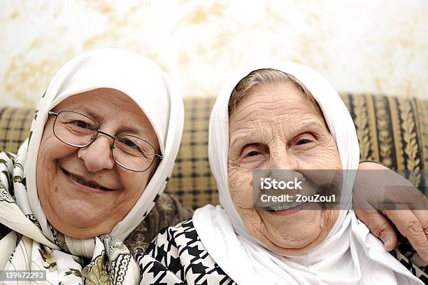 Two Elderly Women Stock Photo - Download Image Now - Senior Adult, Islam, Multiracial Group