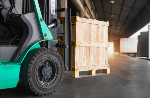 istock Forklift Tractor Loading Wooden Crates into Cargo Container. Distributions Warehouse. Supply Chain. Warehouse Shipping Cargo. Freight Truck Transport. Logistics 1394725518