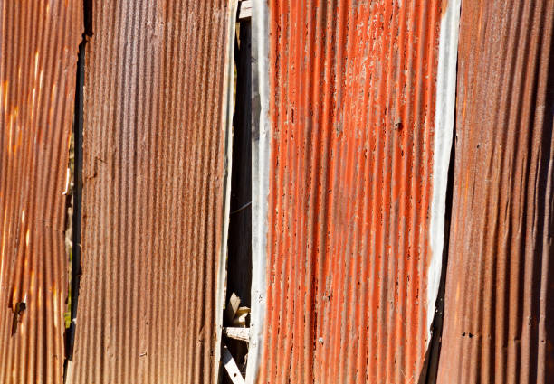 istock Metal wall damaged by wind and rain 1394729091
