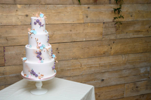Four tier wedding cake with flowers
