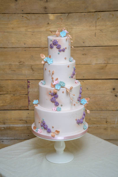 istock Four tier wedding cake with flowers 1394729541