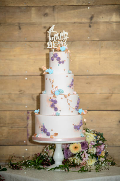 istock Four tier wedding cake with flowers 1394730144