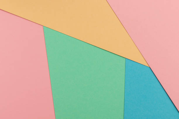 istock Blue, turquoise, yellow and pink paper background. 1394730514