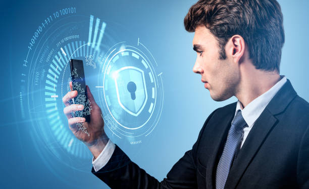 istock Businessman in formal suit is holding smartphone on blue background 1394731274
