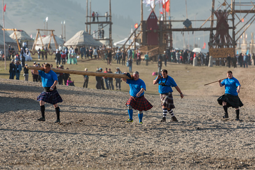 Isyk-Kul, Kyrgyzstan - September ‎29, ‎2018: Athletes of Scottish Highland Games taking part in World Nomad Games