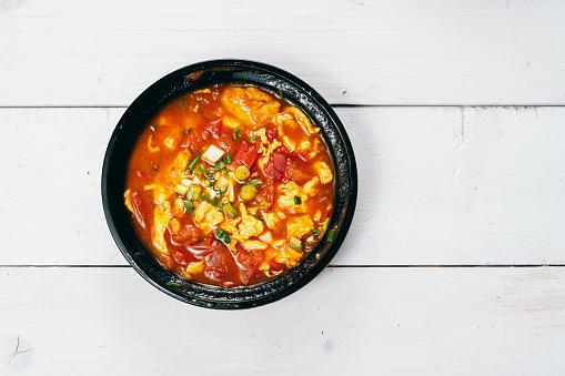 African maize porridge called ugly in bowl. nshima, with meat and sweet potatoes. flat lay