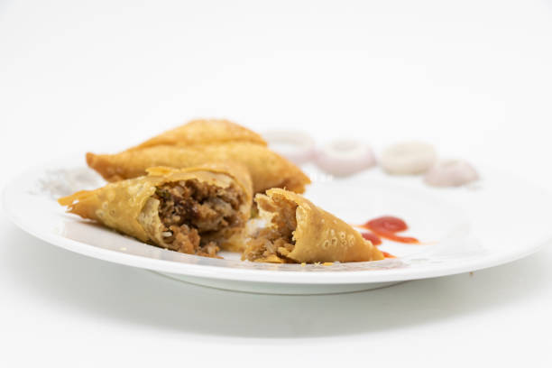 istock golden samosa isolated on white background 1394738466