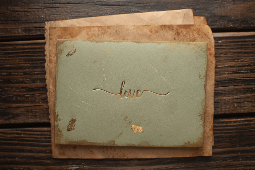 paper in vintage style on a wooden background is used as a backdrop