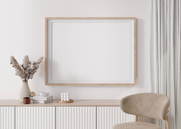 istock Empty horizontal picture frame on white wall in modern living room. Mock up interior in minimalist, contemporary style. Free space for your picture, poster. Console, pampas grass in vase. 3D rendering 1394745739