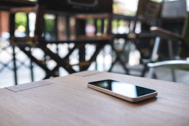istock A single mobile phone on wooden table 1394746748