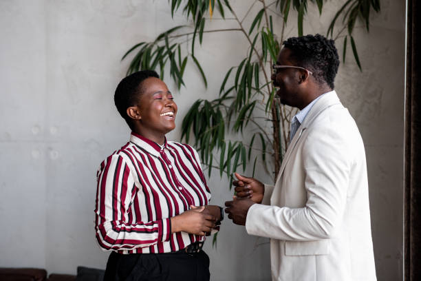 istock Two young black businesspeople smiling 1394748239