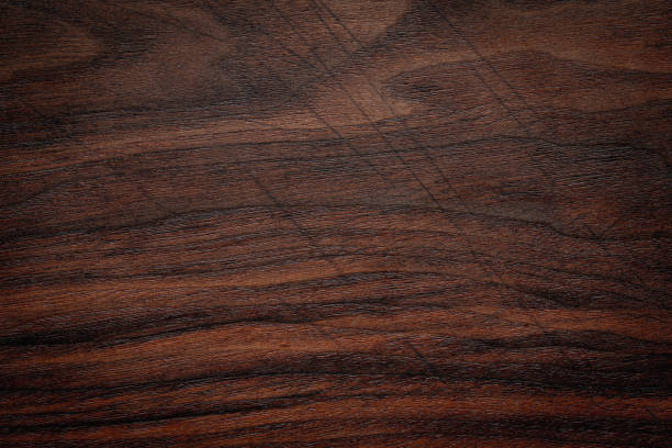 istock Wood plank texture background. Scratched dark tone walnut wood plank texture. 1394748894