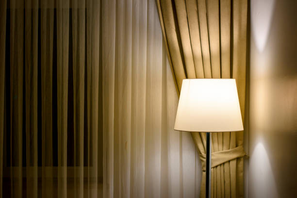 lamp and curtain in the dark room lamp and curtain in the dark room lamp shade stock pictures, royalty-free photos & images