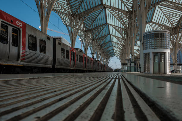 Lisboa , Portugal; 30 April 2022: Oriente train station in Lisbon with a CP train stopped on the line