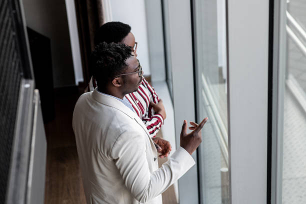 istock Two young black businesspeople taking a break 1394750079