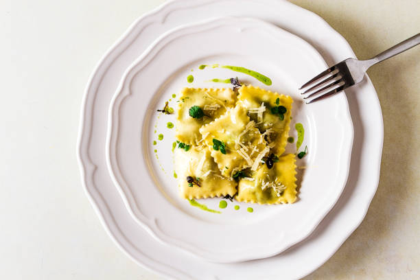 istock Ravioli with spinach and cheese, green sauce, on a light background, selective focus, no people, 1394751066