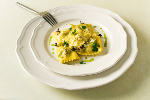 istock Ravioli with spinach and cheese, green sauce, on a light background, selective focus, no people, 1394751100