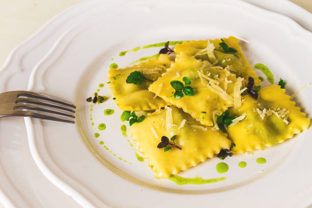istock Ravioli with spinach and cheese, green sauce, on a light background, selective focus, no people, 1394751349