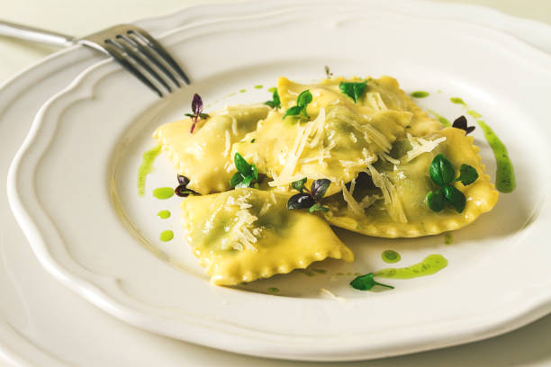 istock Ravioli with spinach and cheese, green sauce, on a light background, selective focus, no people, 1394751352