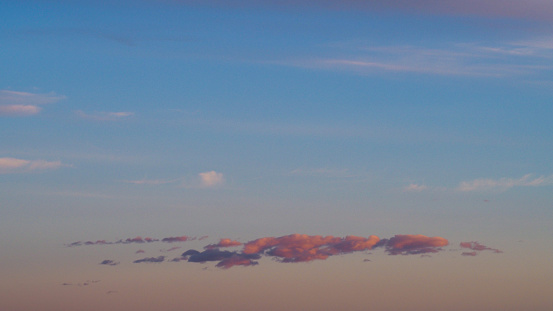 Beautiful yellowish and pinkish hues observed under high altitude clouds, during sunset