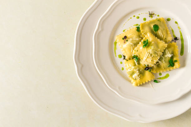 istock Ravioli with spinach and cheese, green sauce, on a light background, selective focus, no people, 1394751536