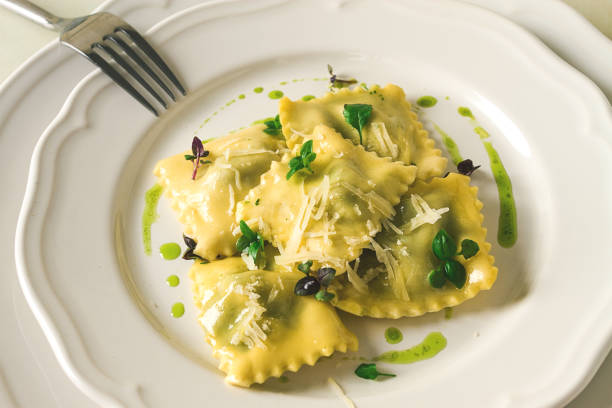 istock Ravioli with spinach and cheese, green sauce, on a light background, selective focus, no people, 1394751589