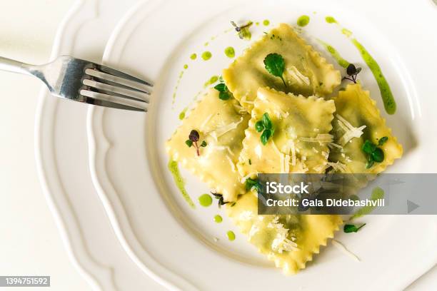 Ravioli With Spinach And Cheese Green Sauce On A Light Background Selective Focus No People Stock Photo - Download Image Now