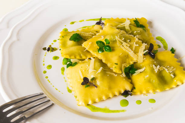 istock Ravioli with spinach and cheese, green sauce, on a light background, selective focus, no people, 1394751595