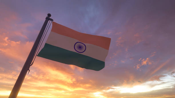 India Flag on Flagpole by Evening Sunset Sky stock photo