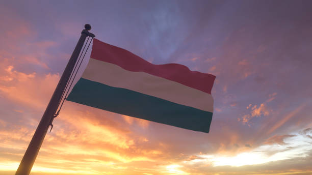 istock Hungary Flag on Flagpole by Evening Sunset Sky 1394754172