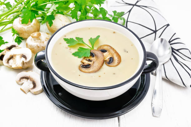 istock Soup puree of champignon in bowl on board 1394757695