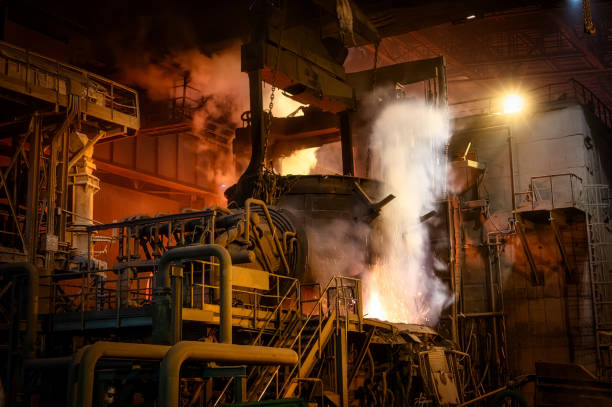 istock Loading scrap metal into electric arc furnace 1394758044