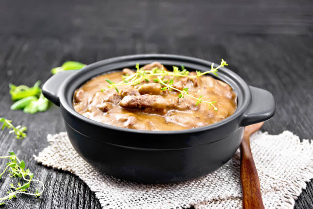 istock Goulash of beef in pan on black board 1394758713